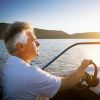 mature man driving speedboat